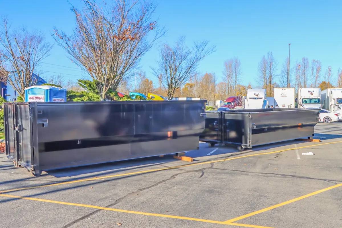 Professional dumpster rental service with roll-off container on residential driveway in Schaumburg